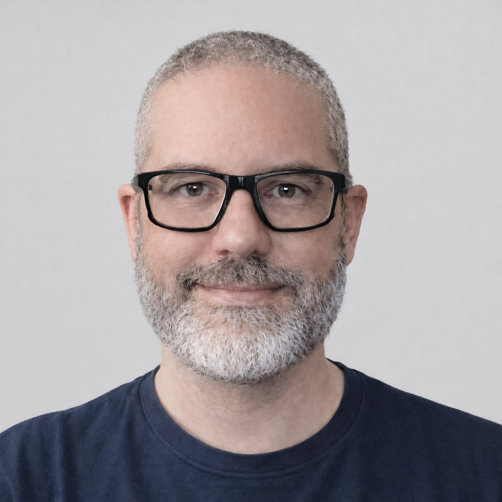 Harry Wynn wearing glasses and a navy shirt